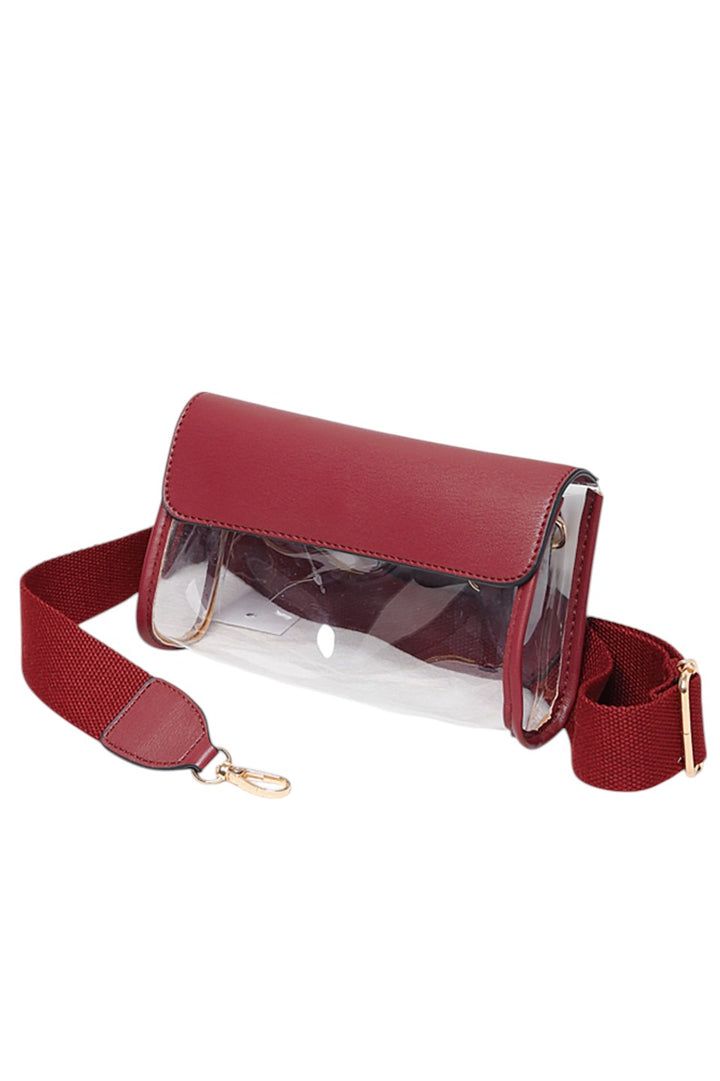 Solid Trim Clear Stadium Crossbody Bag combines transparency with reinforced solid trim for enhanced durability and style. Designed to meet stadium security requirements, it offers easy visibility of contents while maintaining a sleek, structured look. Its crossbody design ensures comfortable, hands-free wear, making it a practical choice for events where convenience and compliance are essential.