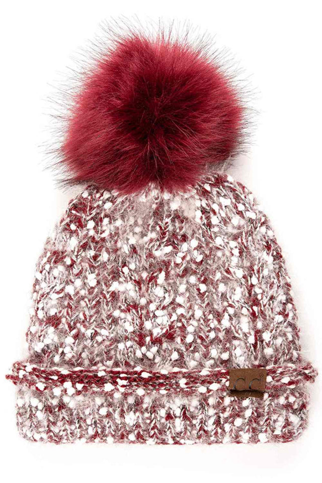 y The C.C Eyelash Confetti Yarn Knit Beanie with Pom features soft eyelash yarn blended with subtle confetti flecks for a fun, textured look. Topped with a fluffy pom-pom, it delivers cozy warmth and a playful sparkle perfect for cold-weather styling.