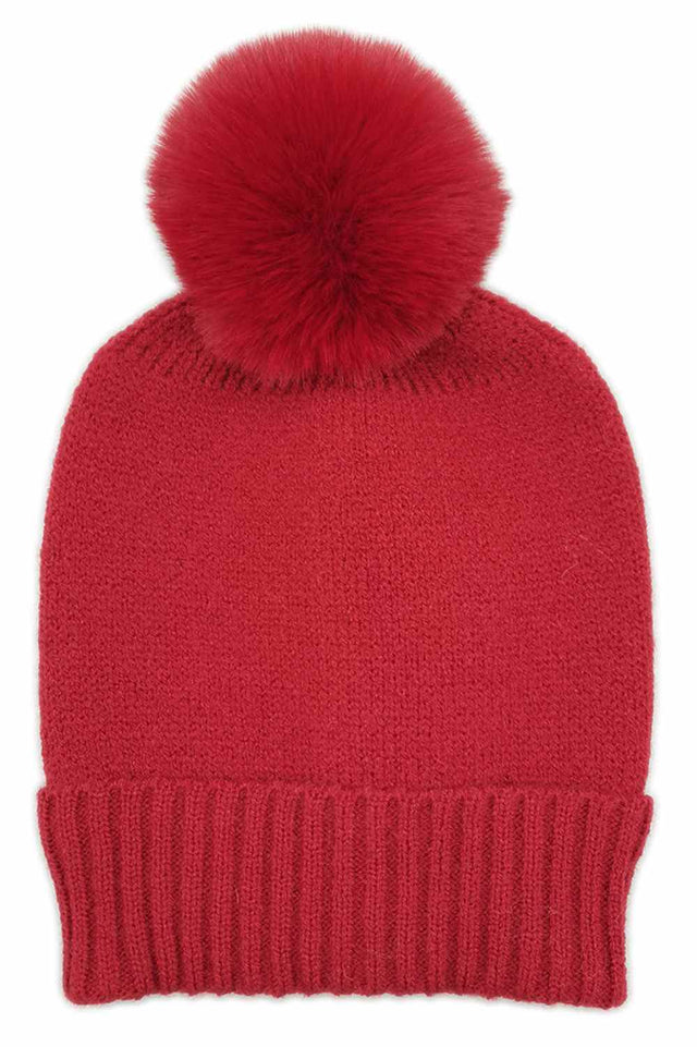 Burgundy The Solid Color Knit Beanie with Pom features a simple, timeless knit design topped with a playful pom for a stylish winter look. Made from soft, stretchy fabric, it provides cozy warmth and a comfortable fit for everyday cold-weather wear.