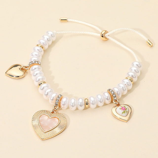 Madeline Love Cream, Gold Multi Heart Charm Station Pearl Beaded Adjustable Bracelet - Bracelets