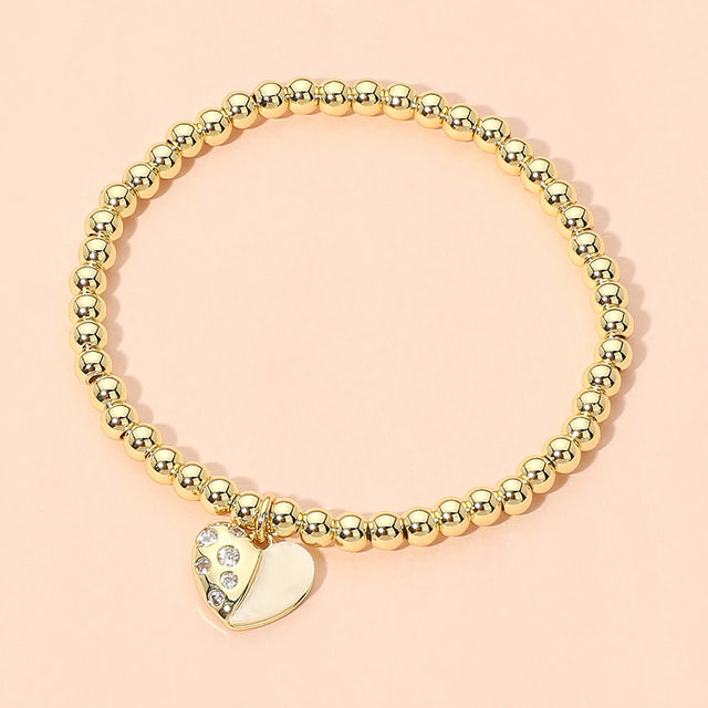 Madeline Love Gold Stainless Steel Heart Charm Beaded Stretch Bracelet