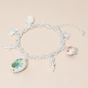 Madeline Love Green, Matte Silver Vintage Floral Ceramic Charm Metal Angel Flower Stem Honey Bee Charm Station Bracelet - Bracelets