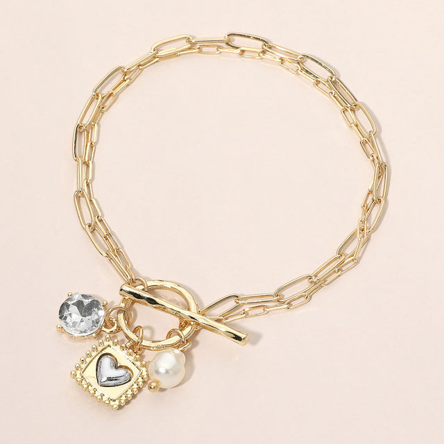 Madeline Love Cream, Gold Chunky Pearl Heart Crystal Charm Paper Clip Chain Toggle Bracelet