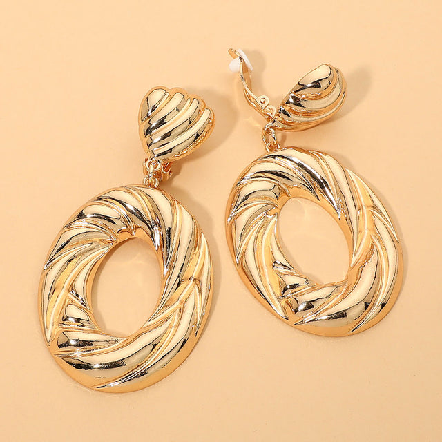 Madeline Love Gold Bold Sculptural Swirl Hop Drop Statement Clip On Earrings