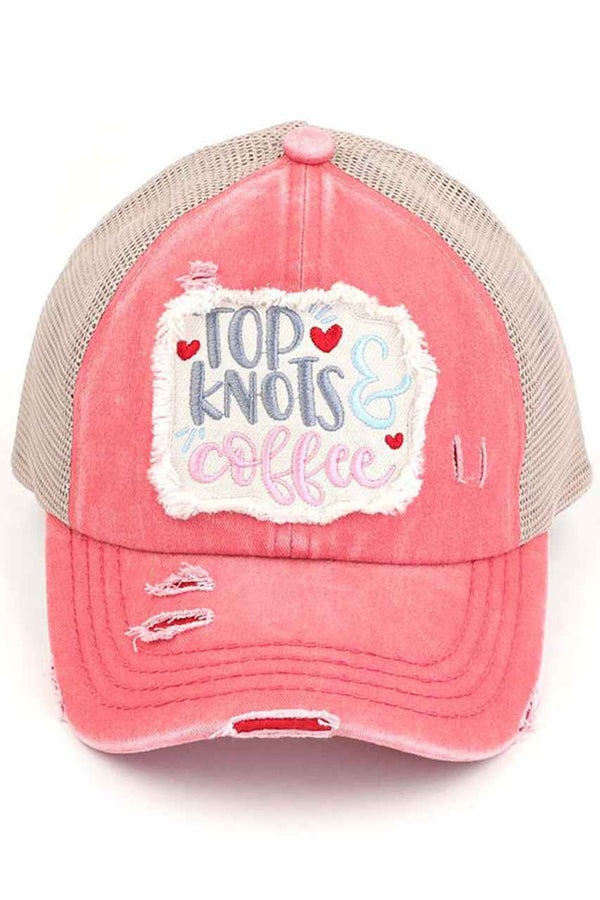 CORAL-C.C DISTRESSED TOP KNOTS AND COFFEE PATCH PONYCAP is an essential accessory for coffee lovers. Made with distressed fabric and a stylish top knot, it also features an embroidered coffee patch. Stay fashionable while showing off your love for coffee.