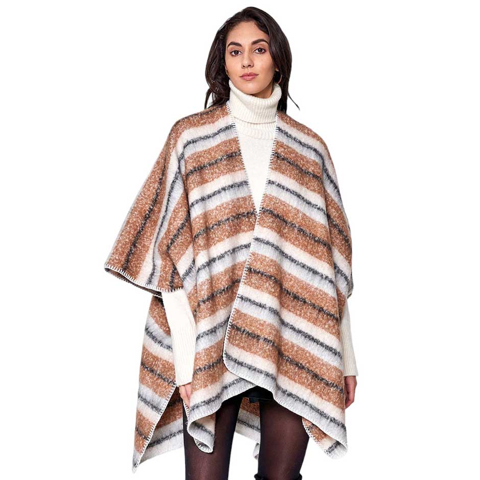 Brown Cozy Striped Three Tone Ruana Poncho, is made with a blend of soft, durable materials for maximum warmth and comfort. The unique three-tone striped pattern is both fashionable and eye-catching. A thoughtful gift for fashion-loving friends and family members, special ones, and colleagues this winter.