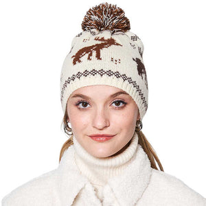 Camel Reindeer Nordic Pom Pom Beanie Hat, is perfect for enhancing any outfit all year round. It features a knitted texture and extra fluffy pom pom detailing for added warmth and protection. Keep yourself warm while looking great with this cozy winter hat in this Christmas festive and make a nice gift with this.