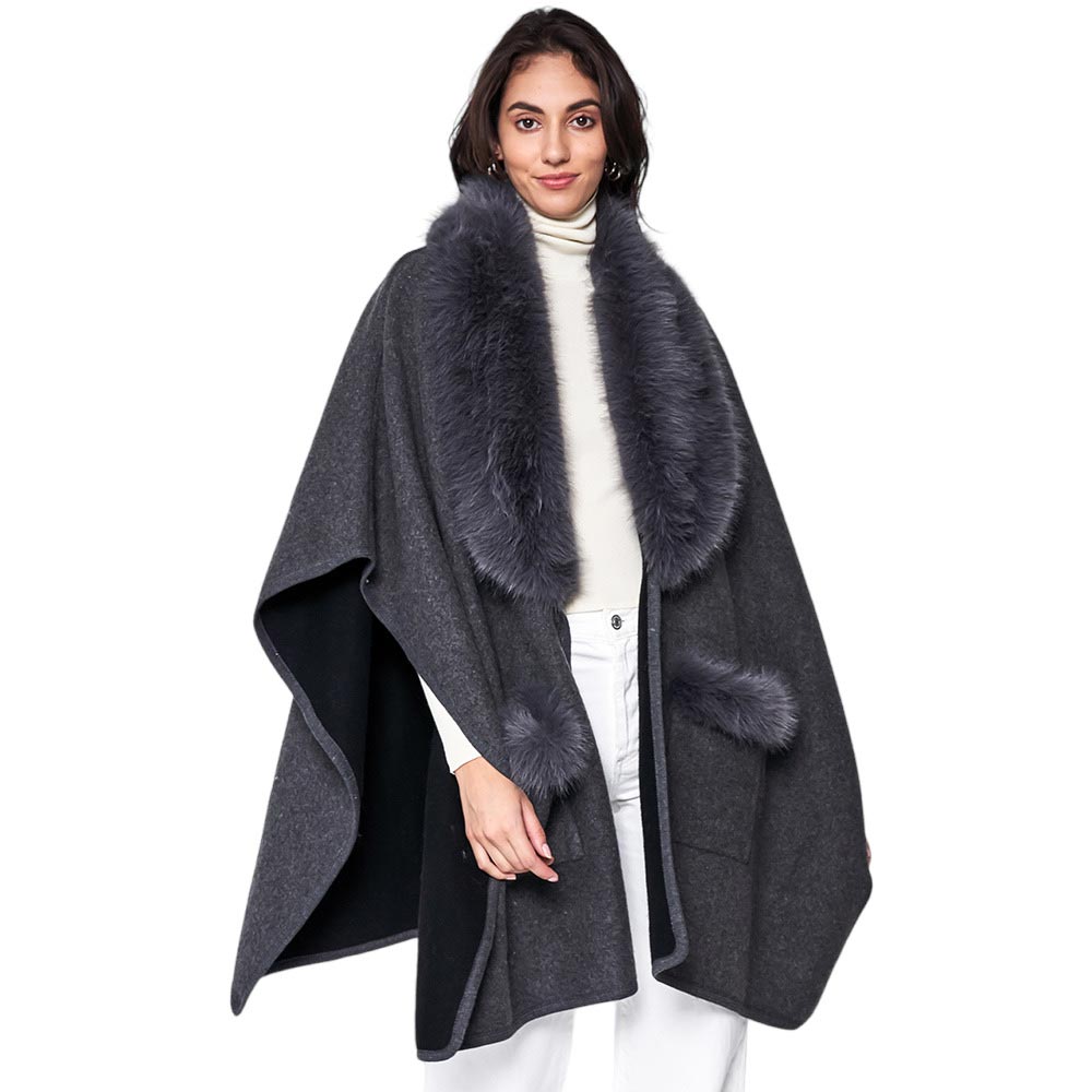Black Faux Fur Trimmed Front Pockets Ruana Poncho, Elevate your winter style. Crafted with faux fur accents and featuring convenient front pockets, it adds warmth, texture, and a touch of elegance to any outfit. Awesome gift choice for your family members, friends, fashion-loving young adults, colleagues, or yourself.