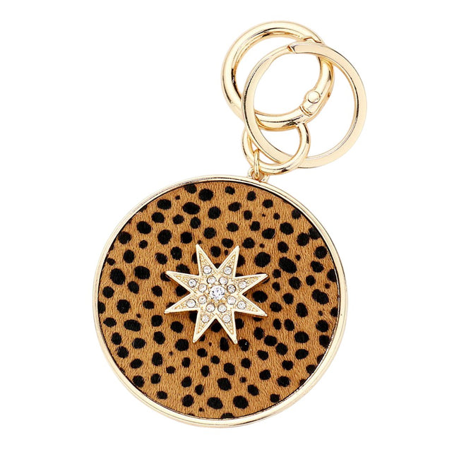 Tan Cheetah Patterned Genuine Leather Calf Round Bag Charm features a unique cheetah pattern, adding a touch of style and personality to any bag. Made from high-quality leather, it is durable and long-lasting. Perfect for fashion-conscious individuals looking to make a statement.