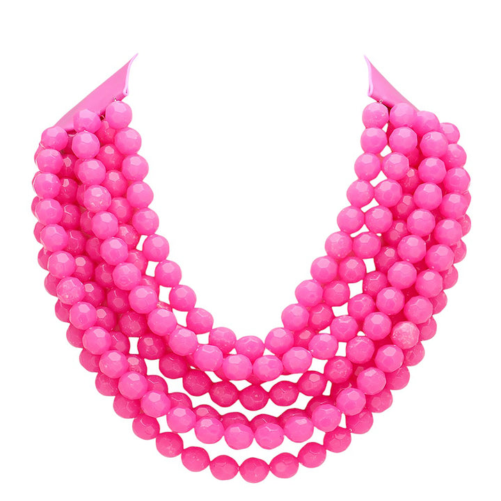 Pink beaded necklace on a white background