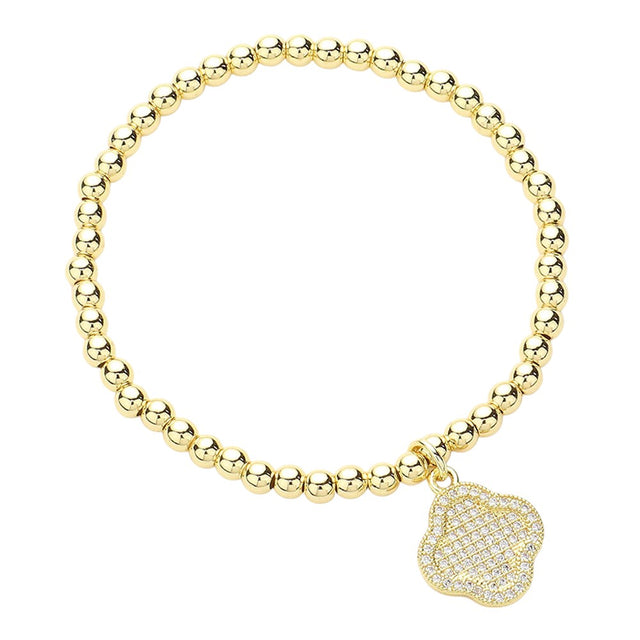 Clear Gold CZ Stone Paved Quatrefoil Charm Stainless Steel Ball Stretch Bracelet is a stunning addition to any jewelry collection. The intricate quatrefoil design, embellished with sparkling CZ stones, adds a touch of elegance. Made with durable stainless steel and featuring a stretch design, it offers both style and comfort.