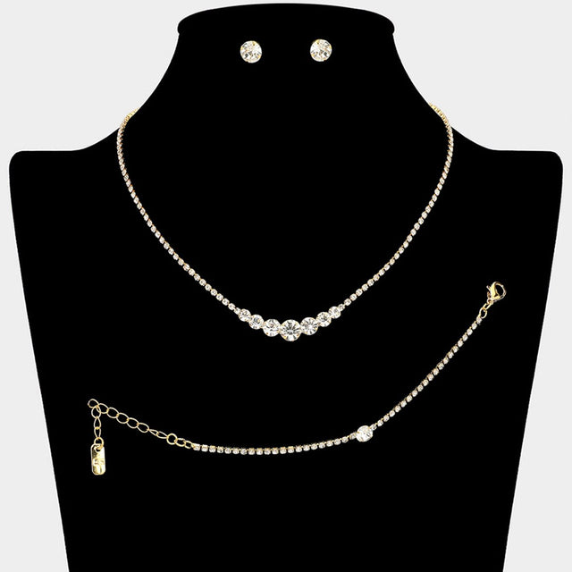 Clear Gold Timeless matching necklace, stud earring, and bracelet set designed with a clean round stone centerpiece for effortless elegance. Ideal for weddings, formal events, parties, and everyday special occasion styling. A versatile set that delivers refined sparkle and coordinated sophistication.