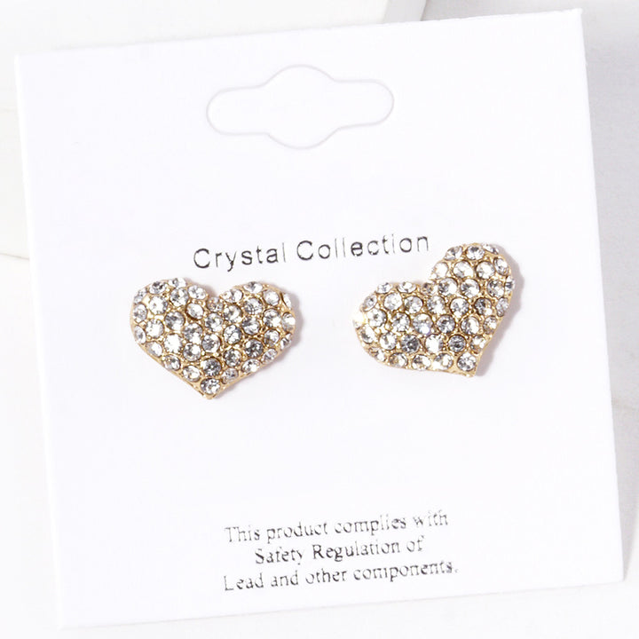 Clear-Gold-Crystal Pave Heart Stud Earrings are expertly crafted with sparkling crystals, adding a touch of elegance to any outfit. Made with precision and attention to detail, they are perfect for special occasions or everyday wear. Upgrade your style with these stunning earrings.