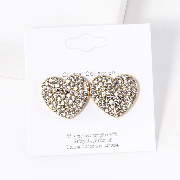 Clear-Gold-Crystal Stone Paved Heart Stud Earrings feature a sparkling design that adds a touch of elegance to any outfit. Crafted with expert precision and quality materials, these earrings are perfect for any occasion. The heart-shaped studs are encrusted with shimmering crystals, making them a stunning addition to any jewelry collection. 