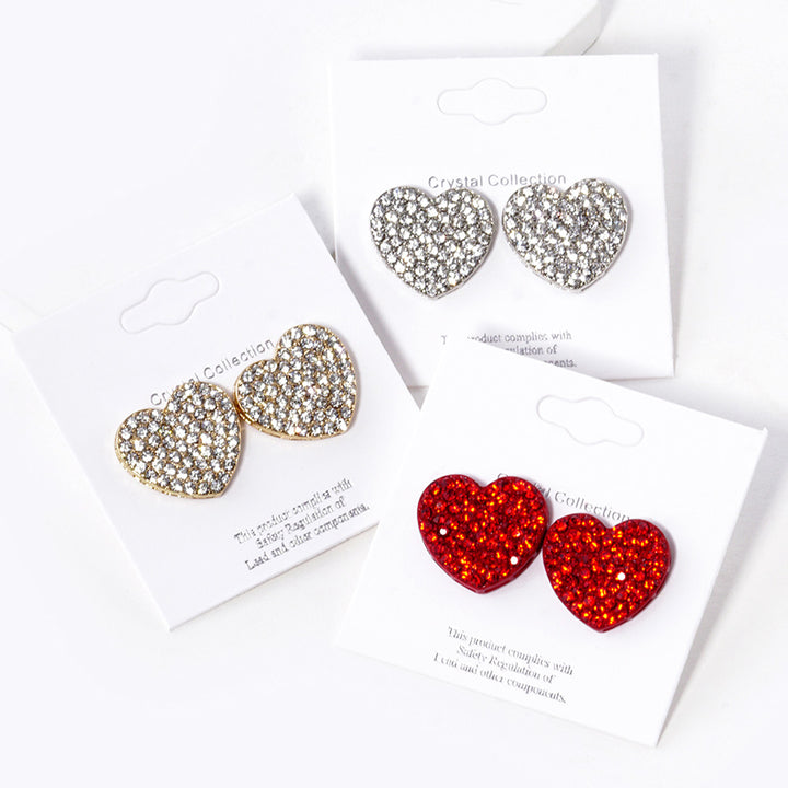 Clear-Gold-Crystal Stone Paved Heart Stud Earrings feature a sparkling design that adds a touch of elegance to any outfit. Crafted with expert precision and quality materials, these earrings are perfect for any occasion. The heart-shaped studs are encrusted with shimmering crystals, making them a stunning addition to any jewelry collection. 