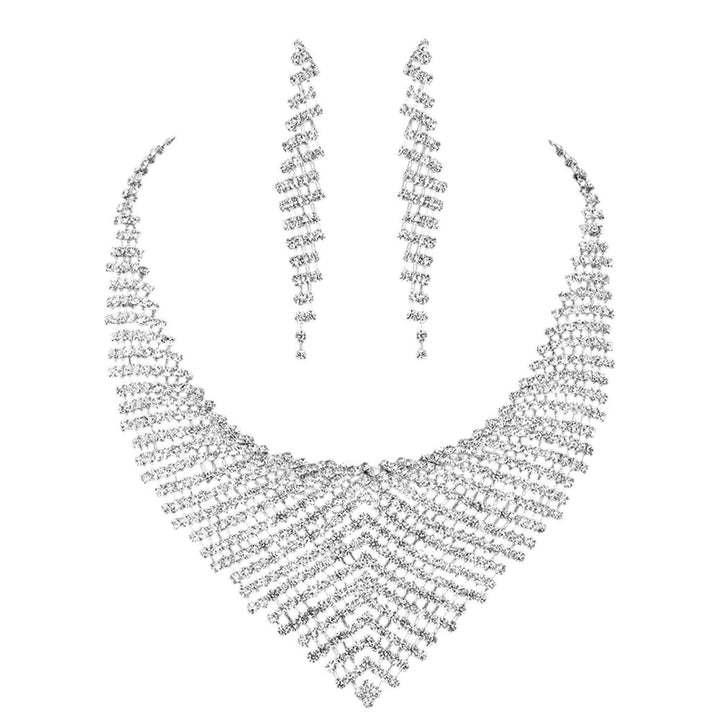 Clear Rhinestone Paved Collar Necklace adds an instant touch of glamour to any outfit. With precision-placed rhinestones, this necklace shines and sparkles with every movement. The perfect accessory for any formal event or special occasion.