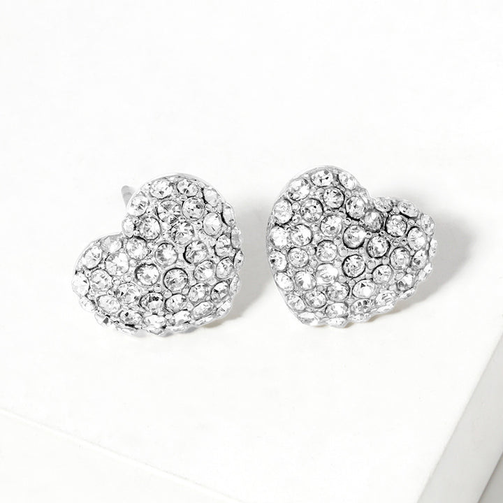 Clear Rhodium Crystal Pave Heart Stud Earrings bring a stylish and sophisticated touch to any outfit. Featuring a sparkling crystal pave design, these earrings add elegance to your look. Crafted with high-quality materials, they are perfect for any occasion. 