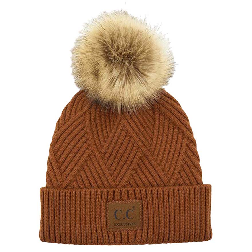 Cocoa C.C Heather Beanie Hat With Pom Pom And Suede Patch, provides excellent protection and a fashionable look with its soft heather knit material, faux fur pom pom, and stylish suede patch. The fabric is designed to keep you comfortably warm in cold weather. Add this fashionable accessory to the winter wardrobe collection.