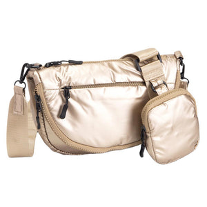 Copper Glossy Puffer Half Moon Crossbody Bag, the lightweight, stylish design features a durable water-resistant nylon that is perfect for outdoor activities. The adjustable shoulder strap makes it easy to sling across your body for hands-free convenience. Carry your essentials in style and comfort with this fashionable bag.