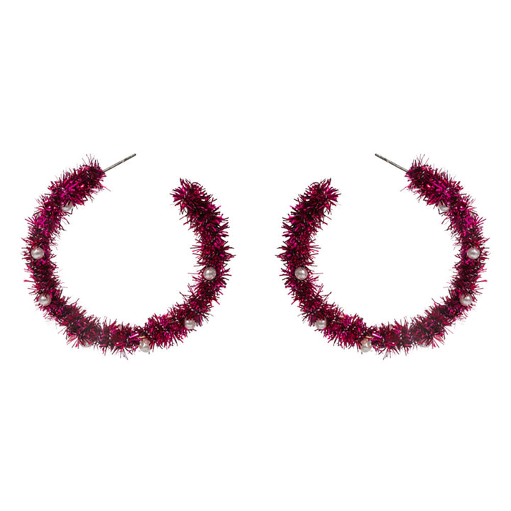Celebrate the season with these festive tinsel hoop earrings, decorated with miniature ornament accents for a cheerful holiday touch. Lightweight and eye-catching, they’re perfect for adding playful flair to party outfits, winter gatherings, or seasonal celebrations.