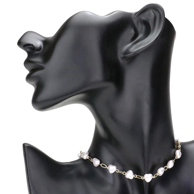 Cream Heart Pearl Link Choker Necklace, is crafted with the utmost attention to detail and quality. It features a unique link design and a stunning heart-shaped pearl, perfect for special occasions or gifting. Its classic design makes it a timeless addition to any collection.