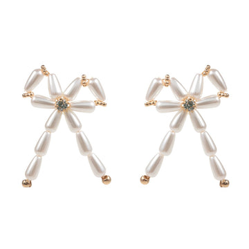 Cream Pearl Beads Bow Earrings are a timeless classic, perfect for any occasion. The elegant pearl beads add a touch of sophistication, while the delicate bow design adds a subtle feminine touch. Made with high-quality materials, these earrings are sure to make a statement.