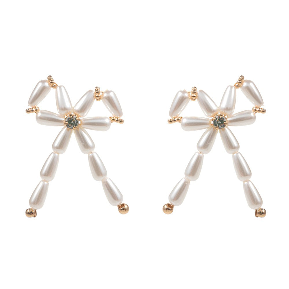 Cream Pearl Beads Bow Earrings are a timeless classic, perfect for any occasion. The elegant pearl beads add a touch of sophistication, while the delicate bow design adds a subtle feminine touch. Made with high-quality materials, these earrings are sure to make a statement.