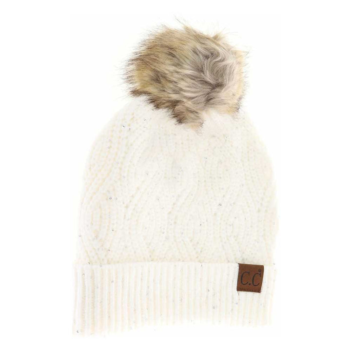 Cream Sequin Brioche Cable Knit Fur Pom C.C Beanie combines classic craftsmanship with a modern touch. Featuring a soft brioche cable knit pattern enhanced by subtle sequins, this beanie adds understated sparkle to cold-weather style. The plush fur pom enhances warmth and a refined aesthetic, making it an ideal accessory for both functionality and fashion during chilly days. Durable and comfortable, it delivers expert-level design that complements any winter wardrobe. 