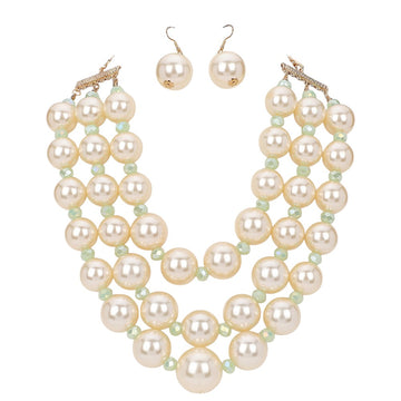 Cream Triple Layered Chunky Pearl Necklace is a gorgeous addition to any outfit. Made with high-quality pearls in a unique triple layer design, this necklace adds a touch of elegance and sophistication to your look. Its chunky style makes a statement while still remaining versatile for any occasion. Upgrade your jewelry collection with this must-have piece. 