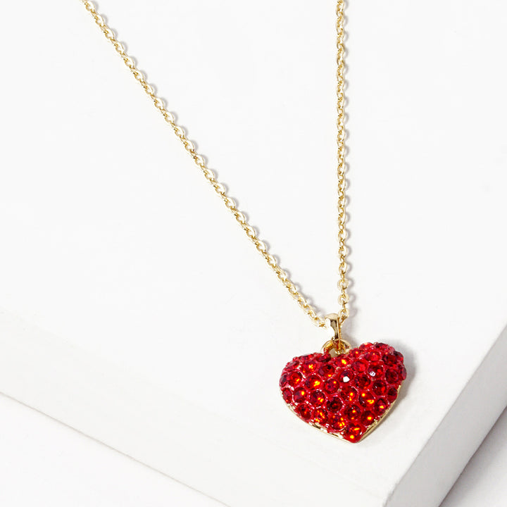 Crystal Pave Heart Pendant Necklace is crafted to bring a touch of sophistication to any outfit. Its sparkling pave crystals are timeless and elegant, while the heart-shaped pendant symbolizes love and affection. Made from high-quality materials, this necklace is designed to make a statement and elevate your style effortlessly. 