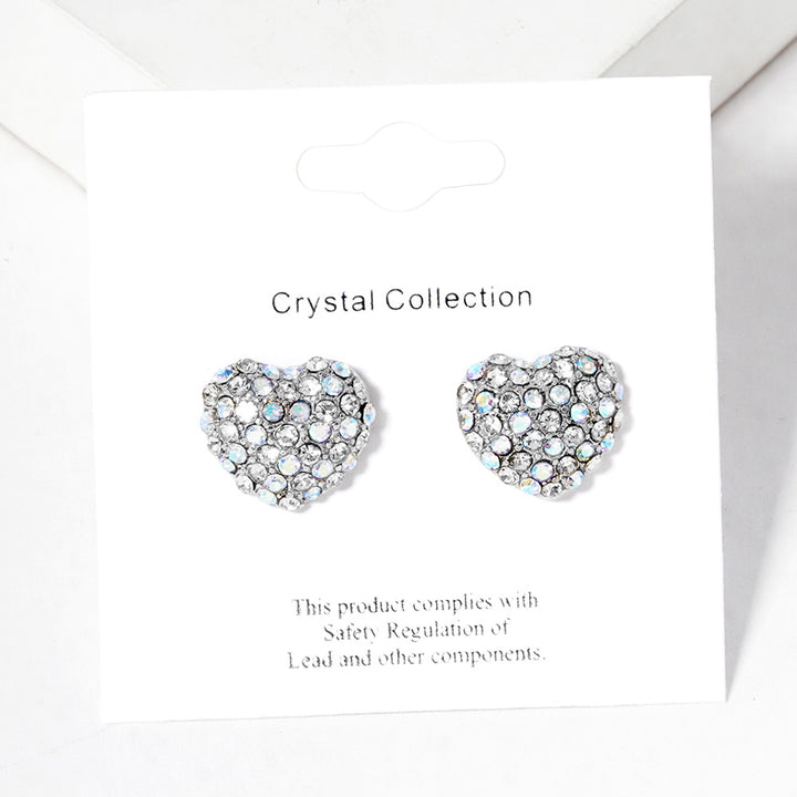 Crystal Pave Heart Stud Earrings bring a stylish and sophisticated touch to any outfit. Featuring a sparkling crystal pave design, these earrings add elegance to your look. Crafted with high-quality materials, they are perfect for any occasion. 