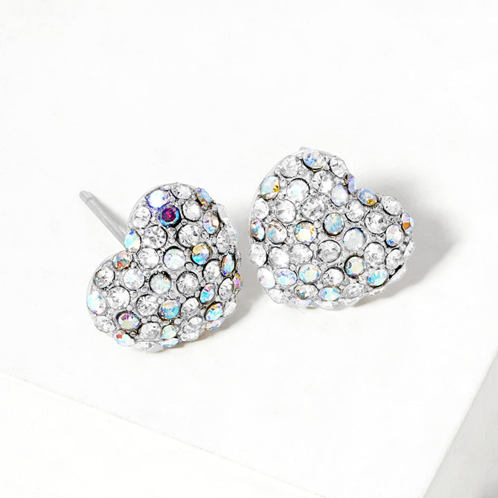 Crystal Pave Heart Stud Earrings bring a stylish and sophisticated touch to any outfit. Featuring a sparkling crystal pave design, these earrings add elegance to your look. Crafted with high-quality materials, they are perfect for any occasion. 