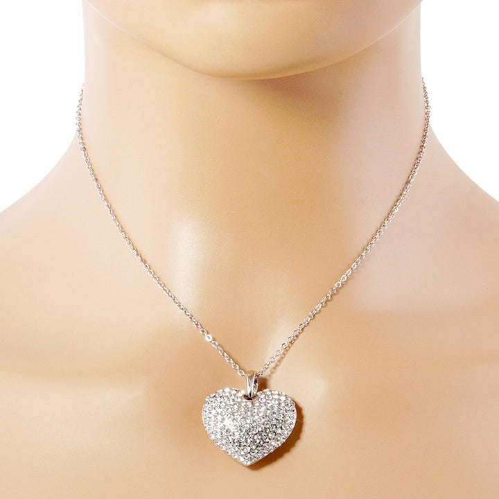 Crystal Rhinestone Pave Heart Pendant Necklace boasts a dazzling display of crystals, meticulously placed to create a stunning heart shape. With its elegant design and meticulous craftsmanship, this necklace is the perfect accessory to add a touch of sparkle to any outfit. 