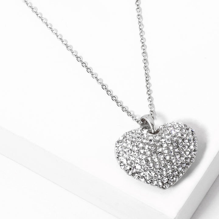 Crystal Rhinestone Pave Heart Pendant Necklace boasts a dazzling display of crystals, meticulously placed to create a stunning heart shape. With its elegant design and meticulous craftsmanship, this necklace is the perfect accessory to add a touch of sparkle to any outfit. 