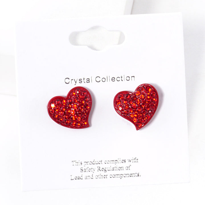 Crystal Rhinestone Paved Heart Stud Earrings bring a touch of elegance to any outfit. The sparkling rhinestones are intricately arranged in a heart-shaped design, adding a romantic and sophisticated charm to your look. Perfect for any occasion, these earrings are a must-have addition to any jewelry collection. 