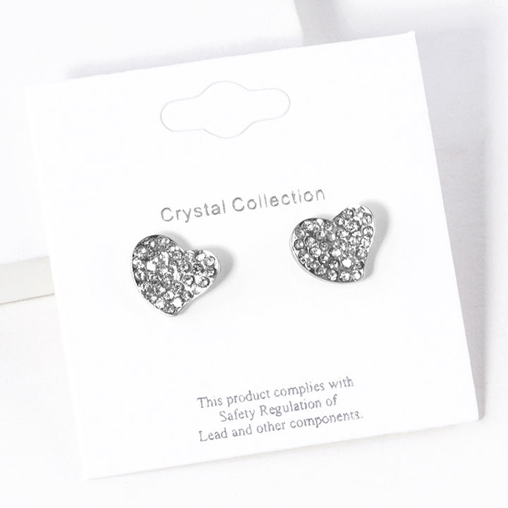 Crystal Rhinestone Paved Heart Stud Earrings bring a touch of elegance to any outfit. Crafted with sparkling crystals, they offer exceptional quality and timeless charm. Perfect for any occasion, these stunning earrings elevate your style effortlessly. 