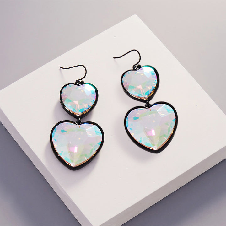 Crystal Stone Double Heart Link Dropdown Earrings are a must-have for any jewelry collection. Crafted with high-quality materials, these earrings feature a stunning crystal stone double heart design that exudes timeless beauty and sophistication. These earrings are perfect for any occasion and add glamour and charm to any outfit. 