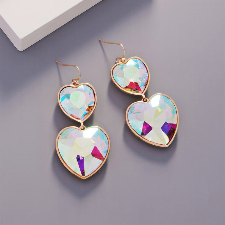 Crystal Stone Double Heart Link Dropdown Earrings are a must-have for any jewelry collection. Crafted with high-quality materials, these earrings feature a stunning crystal stone double heart design that exudes timeless beauty and sophistication. These earrings are perfect for any occasion and add glamour and charm to any outfit. 