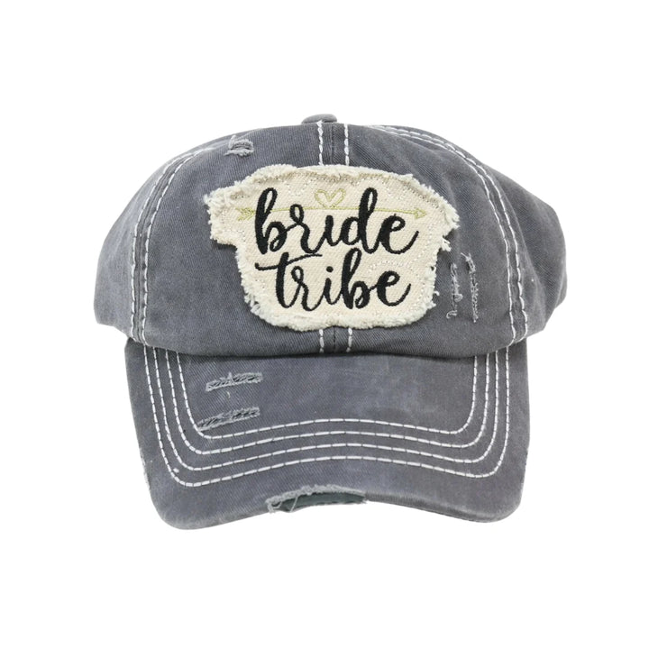Dark Gray Distressed Bride Tribe Patch CC Ball Cap combines casual style with a vintage-inspired look. Featuring a carefully worn finish and a distinctive Bride Tribe patch, it’s perfect for bridal parties seeking a coordinated yet relaxed accessory. The cap offers adjustable comfort and durable construction, making it an ideal choice for celebrating special moments with lasting wear. 
