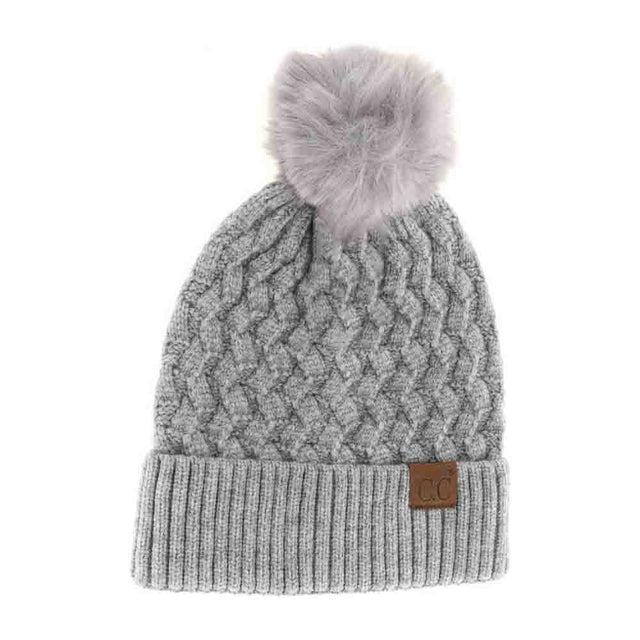 Dark Grey-Woven Cable Knit Cuffed Matching Fur Pom C.C Beanie features a classic cable knit pattern with a comfortable cuffed edge for a secure fit. Topped with a matching fur pom, it combines warmth and style effortlessly. Ideal for cold weather, this beanie offers both insulation and a refined aesthetic suitable for everyday wear. 