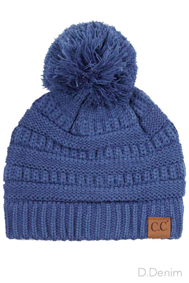Dark Denim Crafted from premium soft acrylic, this C.C knitted beanie delivers warmth and comfort through its quality construction. The classic design features a charming knit pom-pom that adds visual appeal while the one-size-fits-most fit ensures accessibility for most wearers. Ideal for cold weather layering, this versatile beanie transitions seamlessly from casual outings to outdoor activities, making it a practical addition to any seasonal wardrobe.