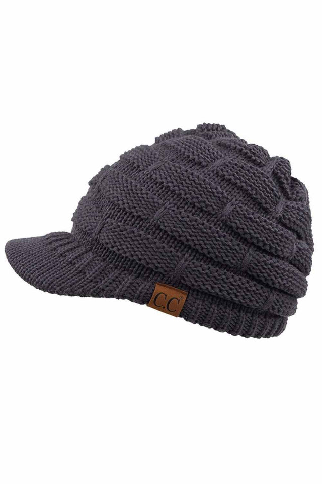 Dark Grey The C.C Ribbed Knit Brim Beanie combines comfort and style in one versatile piece. Made from 100% acrylic, this lightweight beanie features a classic ribbed knit construction with a structured brim for added warmth and coverage. Perfect for casual outings or outdoor activities, it pairs effortlessly with any winter wardrobe.