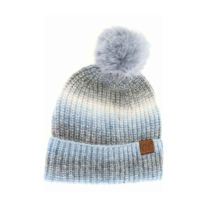 Denim-Multicolored C.C Multicolor Ombre Beanie with Soft Faux Color Fur Pom, wear it before running out the door into the cool air to keep yourself warm and toasty and look absolutely beautiful. You’ll want to reach for this toasty beanie to keep you incredibly warm everywhere and every occasion. 