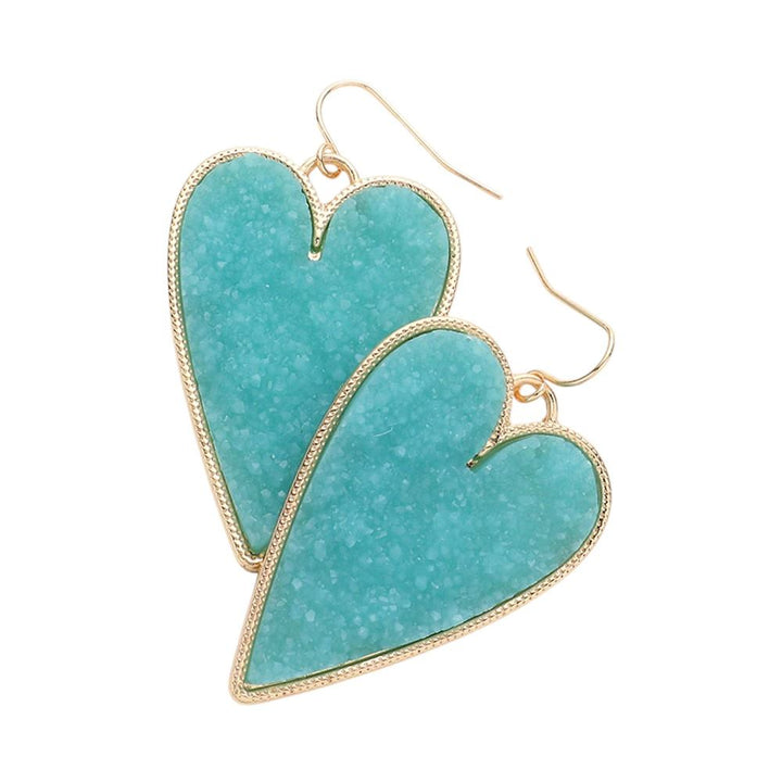 Druzy Heart Dangle Earrings make the perfect addition to any outfit. Featuring gorgeous druzy stones, these earrings bring a touch of elegance and sparkle to your look. The heart-shaped design adds a hint of romance and charm, making them a stunning choice to elevate your style. 