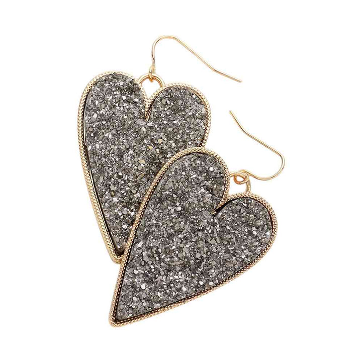 Druzy Heart Dangle Earrings make the perfect addition to any outfit. Featuring gorgeous druzy stones, these earrings bring a touch of elegance and sparkle to your look. The heart-shaped design adds a hint of romance and charm, making them a stunning choice to elevate your style. 