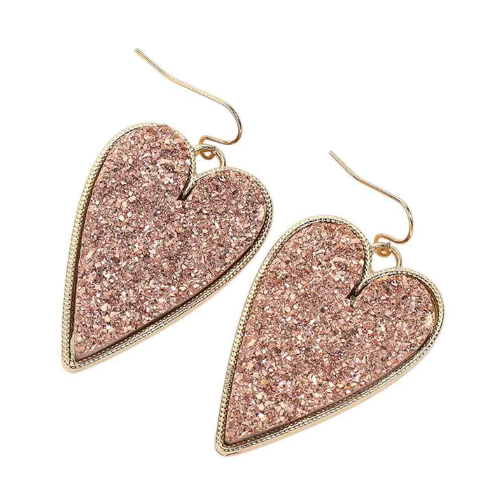 Druzy Heart Dangle Earrings make the perfect addition to any outfit. Featuring gorgeous druzy stones, these earrings bring a touch of elegance and sparkle to your look. The heart-shaped design adds a hint of romance and charm, making them a stunning choice to elevate your style. 