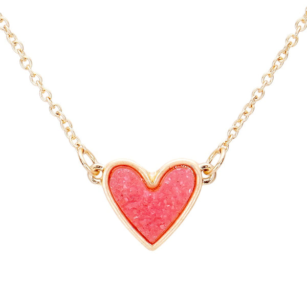 Druzy Heart Pendant Necklace makes a beautiful addition to your jewelry collection. A stunning druzy heart pendant adds elegance and sophistication to any outfit. The unique druzy stone offers a subtle shimmer, making it a versatile accessory for every occasion. 