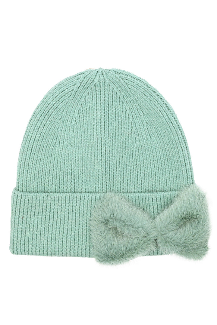 DustyMint C.C Faux Fur Solid Bow Beanie Winter Hat merges thermal protection with refined aesthetics. Crafted with premium faux fur for exceptional insulation, this headwear features a distinctive bow accent that elevates its design profile. Engineered for consistent warmth retention while maintaining breathability, it represents the optimal balance of functional performance 