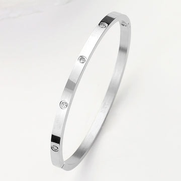 Madeline Love Silver Stainless Steel CZ Stone Embellished Bangle Bracelet - Bracelets