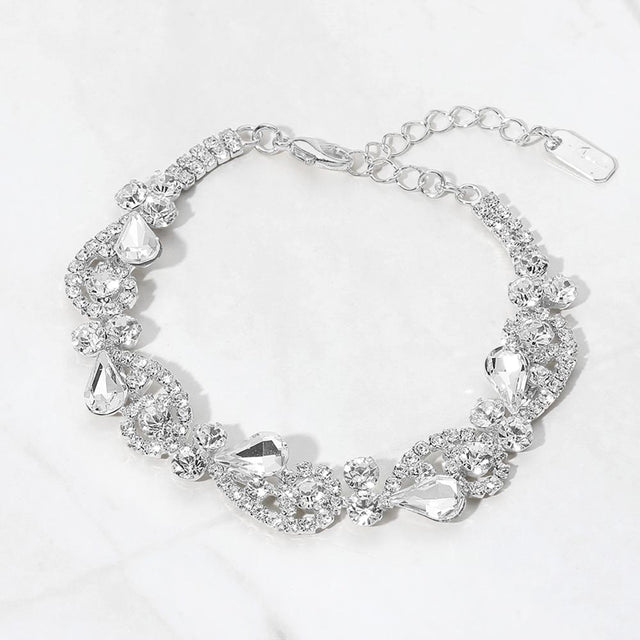 Madeline Love Clear, Silver Teardrop Stone Cluster Swirl Evening Bracelet